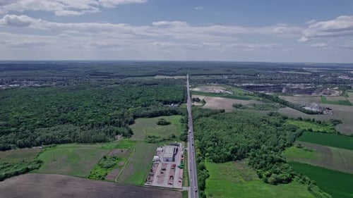 Aerial View of Road Passing Through a Rural Landscape