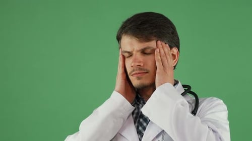 Health Professional Massaging Temples on Green Screen