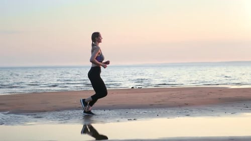 Fitness Woman Active Running Jogging Cardio Training Outdoor Sunset Sand Sea Beach Side View Slowmo