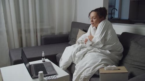 Sick Woman Wrapped in Blanket Telemedicine