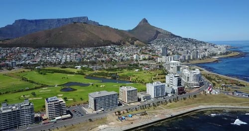 Aerial View of Coastal City and Golf Course