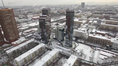 An Aerial View of an Urban Landscape Covered with Snow