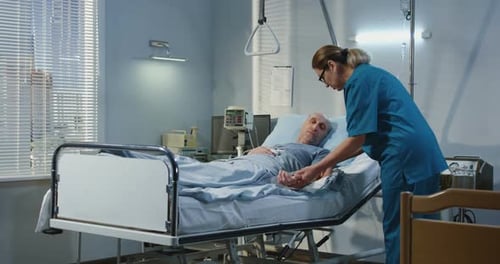 Doctor Visiting Patient in Hospital