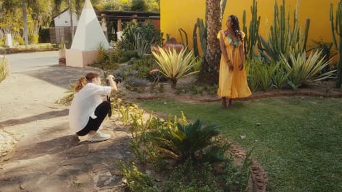 Woman in Yellow Dress Posing for Photographer