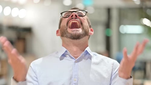 Adult Man Yelling in Frustration and Anger