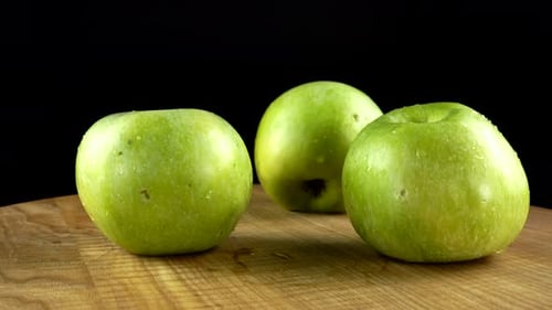 Fresh Green Apples on a Wooden Surface