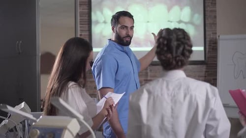 Medical Professionals Consulting on Dental Image