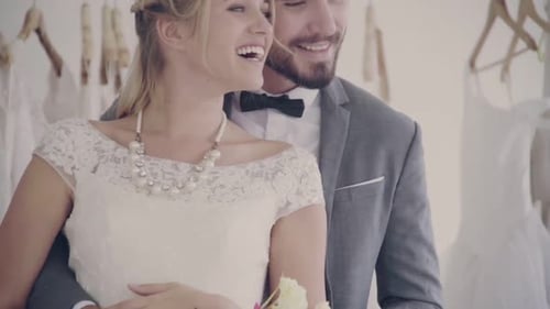 Affectionate Couple Shopping for Wedding Dress