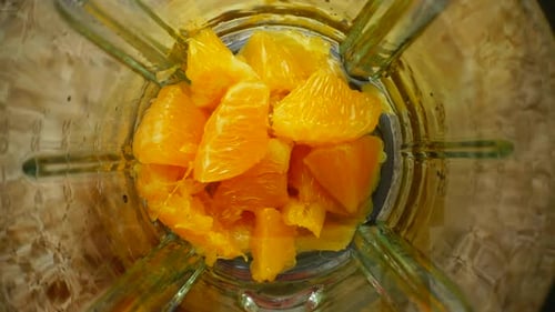 Oranges Being Blended for Healthy Juice