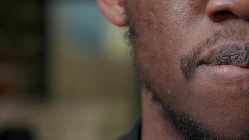 Man Smiles Showing Teeth in Extreme Close Up