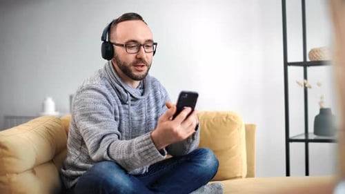 Adult Man Having Video Call on Smartphone