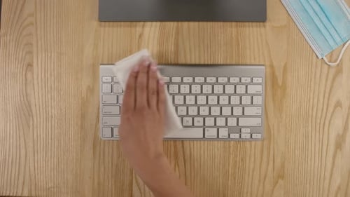 Top View of Female Hands That Spray an Alcohol Antiseptic on a Napkin and Thoroughly Disinfect the