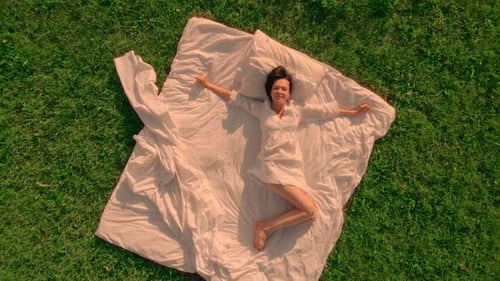 Top View Woman Waking Up Drone Flying Above Bed in the Middle of the Field