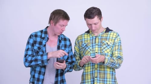 Young Men Sharing Content on their Smart Phones