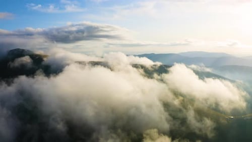 Aerial drone view of White organic Clouds. Scenic aerial view through moving White Clouds