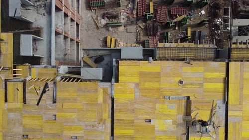 Busy Construction Site and Construction Equipment Aerial Top View