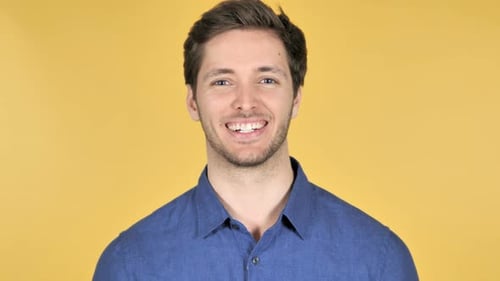 Smiling Man Close Up Portrait on Yellow Background