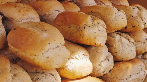 Golden Brown Artisan Bread Loaves Stacked Close Up