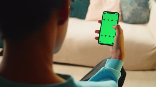 African American Man Using Smartphone with Chroma Key Closeup