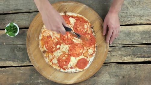 Chef Using Pizza Cutter