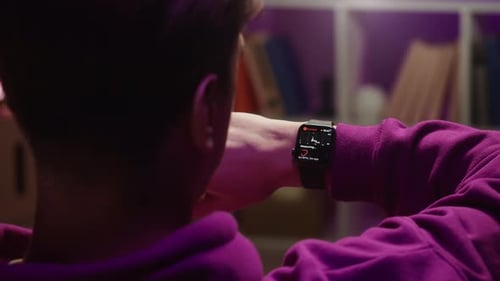 Person Checks Heart Rate on Smart Watch