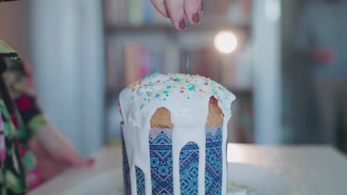 Powdering an Easter Cake with Colored Caramel.