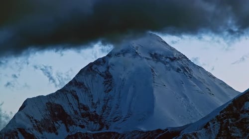Timelapse of the Onset of Night on a Snowy Peak