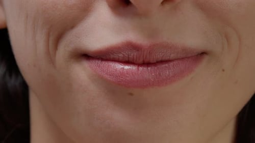 Close-up of Woman Smiling, Showing Teeth