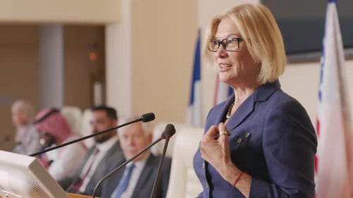 Woman Giving Speech at Business Conference