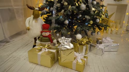 Christmas Tree With Gifts and Decorations at Home