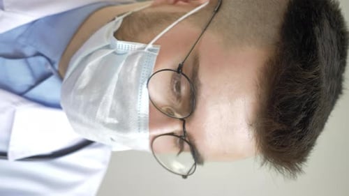 Close Up of a Doctor in Mask and Glasses