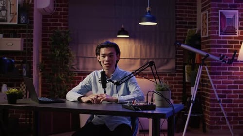 Young Adult Recording Podcast in Modern Room