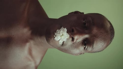 Elegant Young Adult with Flower Close Up