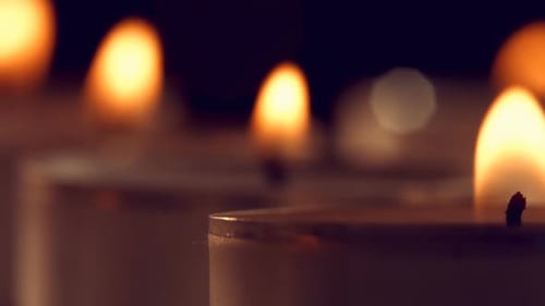 View of candles burning