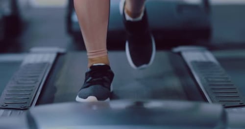 Female Legs are Walking on a Treadmill Leg Exercises