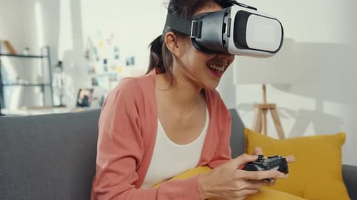 Woman Using VR Headset and Controller at Home