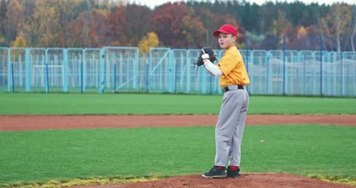 Baseball at School, the Pitcher Pitches Fastball Toward Batter, Boy Throwing the Ball, Slow Motion.