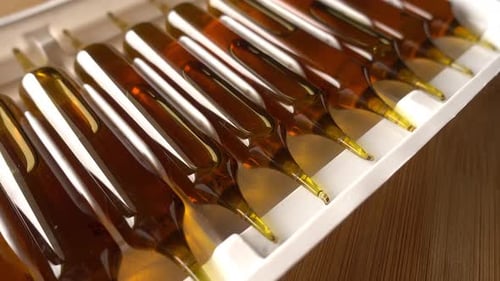 Close up of Brown Liquid in Sealed Ampules