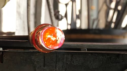 Shaping Orange Glass in the Workshop