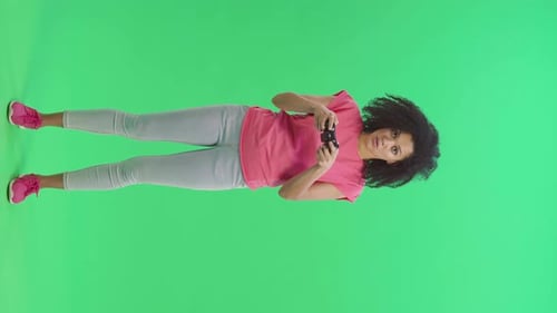 Young Woman Playing Video Game on Green Screen