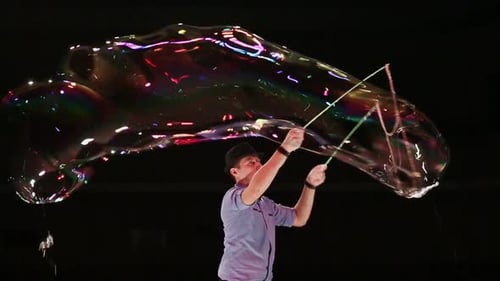 Man Creates Giant Soap Bubbles in the Dark