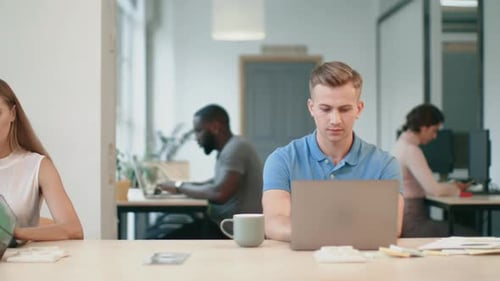 Office Workers Using Computers in Workplace