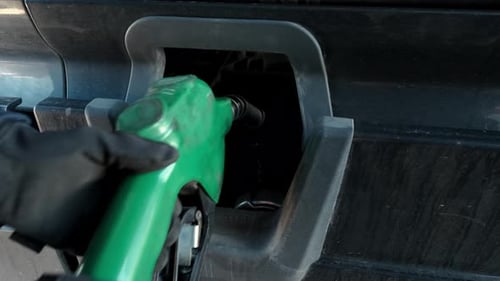 Filling Up a Car or Truck with Fuel at Gas Station Close Up