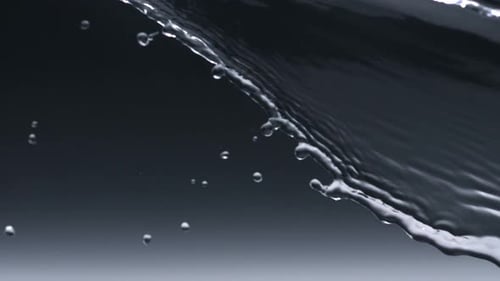 Water Splash and Droplets on Dark Background