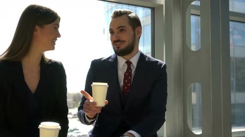 Business People Talking at Break in Office