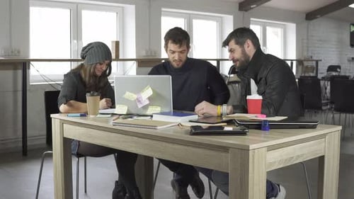 Team of Young Professionals Having a Meeting in a Creative Office