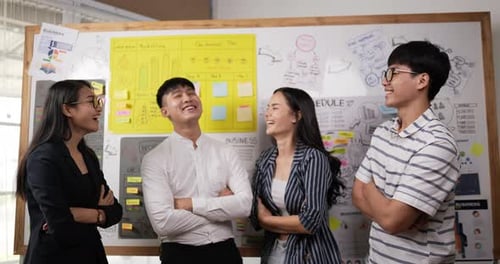 Cheerful Team Collaborates in Modern Office Setting