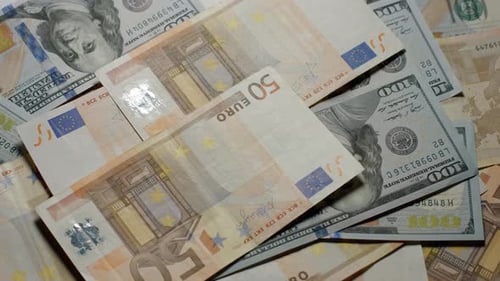 Close Up of Stacked US and Euro Currency