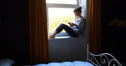 Beautiful woman taking selfie with mobile phone at home 4k