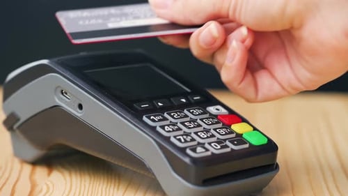 Contactless Payment with Black Credit Card on Reader